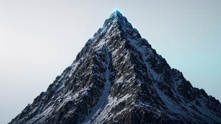 Steep mountain face with a snow couloir