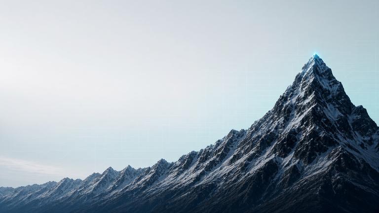 Snow ridge leading to a sharp summit